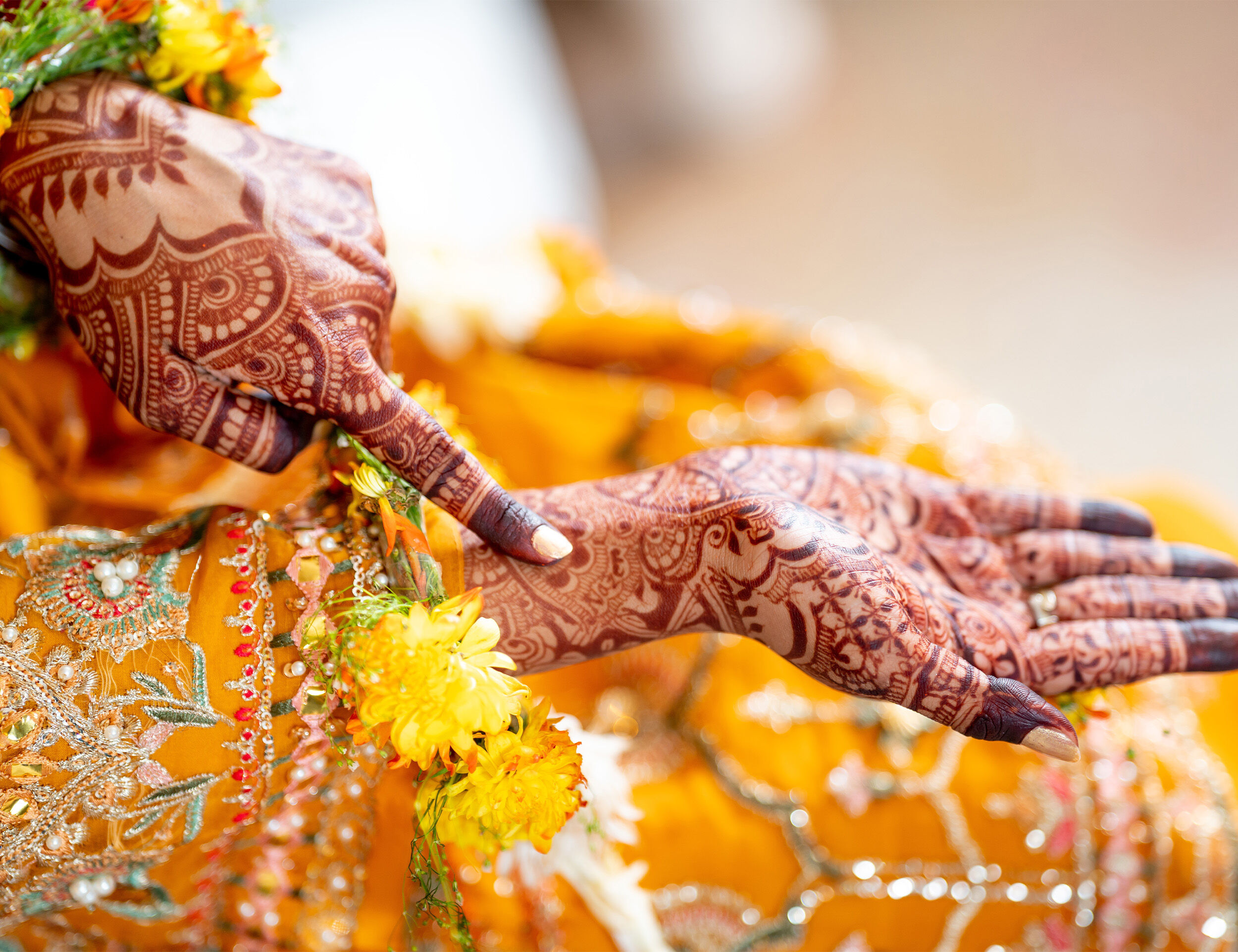 Bridal mehendi design with hidden partner’s name, intricate henna art on hands